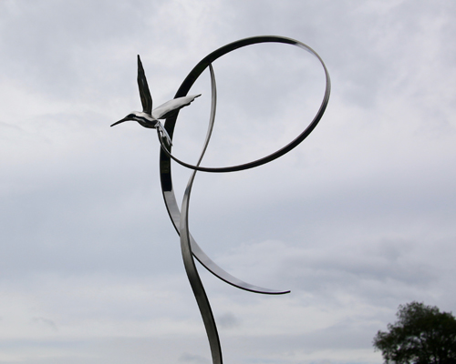 Kinetic sculpture by Amos Robinson "Hummingbird in Flight" contemporary art stainless steel San Diego artist