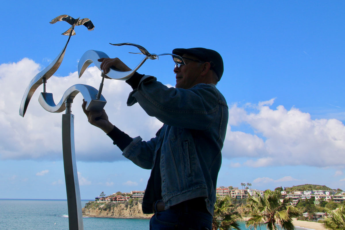 Kinetic art by Amos Robinson stainless steel contemporary art Laguna Beach California installation