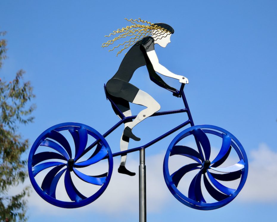 Kinetic bicycle sculpture by Amos Robinson female mountain biker stainless steel contemporary art