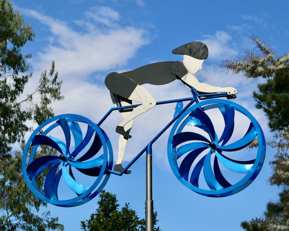 Kinetic bicycle sculpture by Amos Robinson male cyclist road and track stainless steel contemporary art