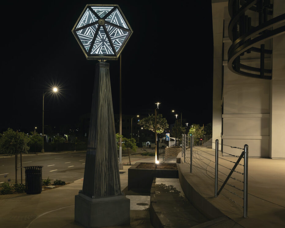 Kinetic sculpture by Amos Robinson rotating infinity mirror LED lights stainless steel contemporary art